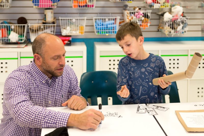 Cedar Point Elementary School Principal Mark Marinoble (left) interacts with a first-grade student in the Tech Lab.
