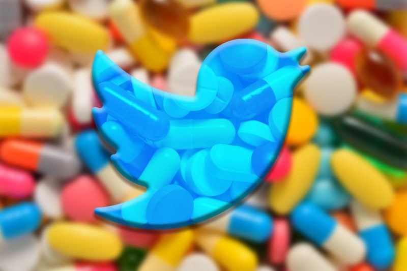 twitter logo above a stack of prescription pills