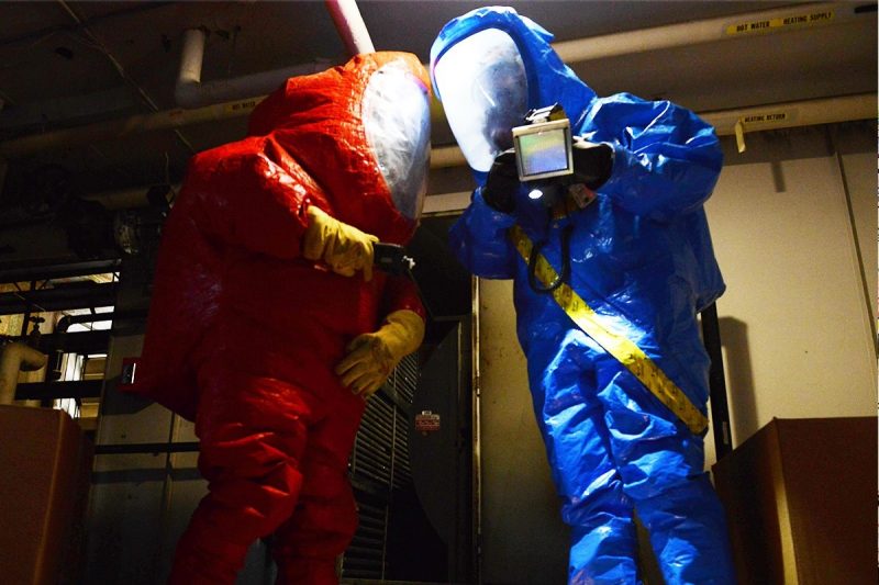 first responders in hazmat suits take environmental readings during a simulated anthrax attack
