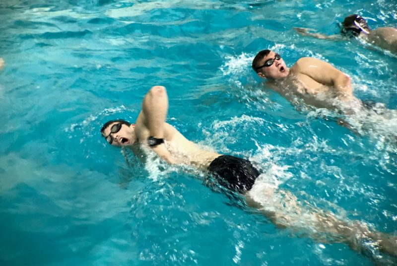 Cadets swim in a pool.