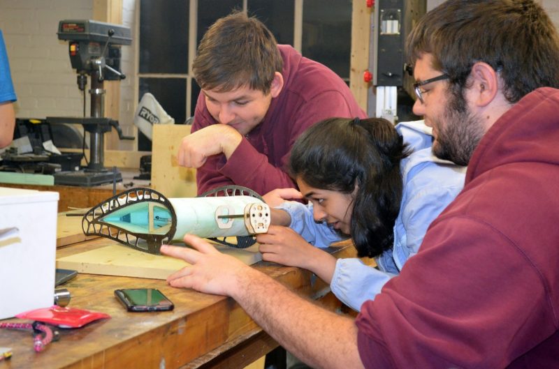 Seniors Brady Reisch, Sapna Rao and John Kiene modify their plane in the Joseph F. Ware Jr. lab