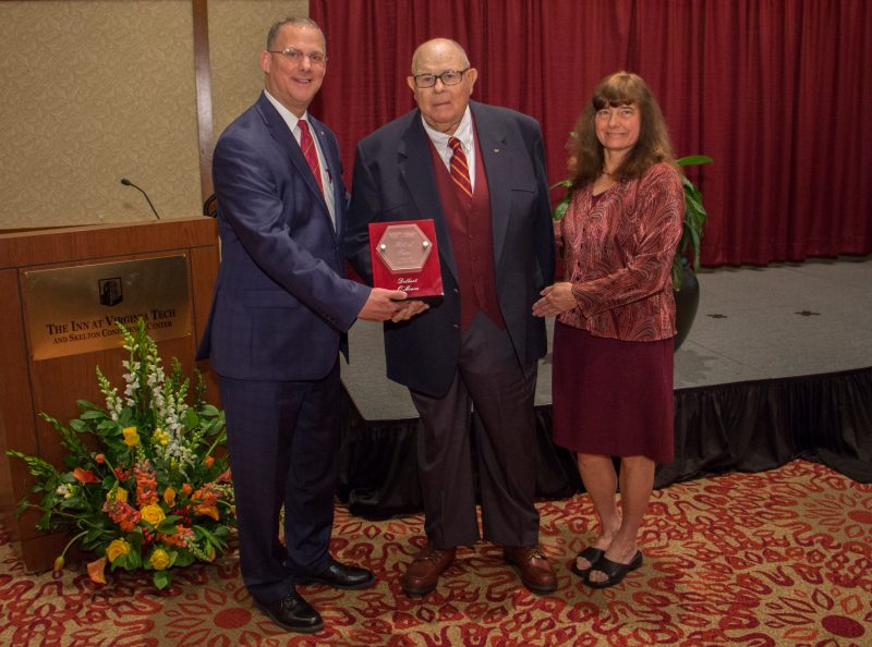 Delbert O'Meara is inducted to the Virginia Tech College of Agriculture and Life Sciences Hall of Fame at the annual college alumni awards ceremony.  To his left, stands Alan Grant, dean of the College of Agriculture and Life Sciences. On his right, Dixie Watts Dalton, president of the college's Alumni Organization.