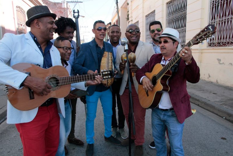 Members of the Cuban ensemble El Septeto Santiaguero perform on the street.
