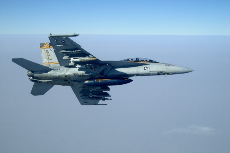 An F/A-18F Super Hornet flies over the Arabian Gulf.