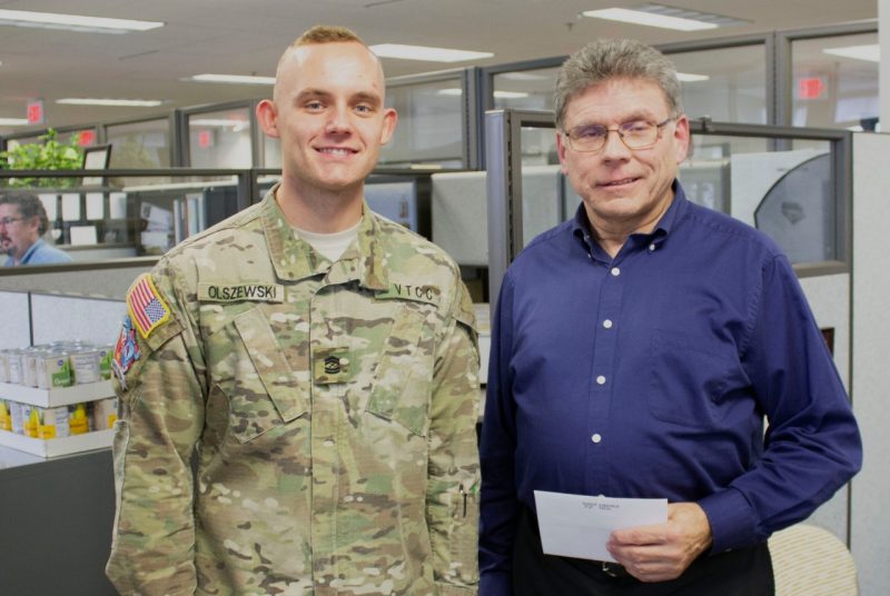 Cadet Adam Olszewski delivered gift to Emmett Wright.