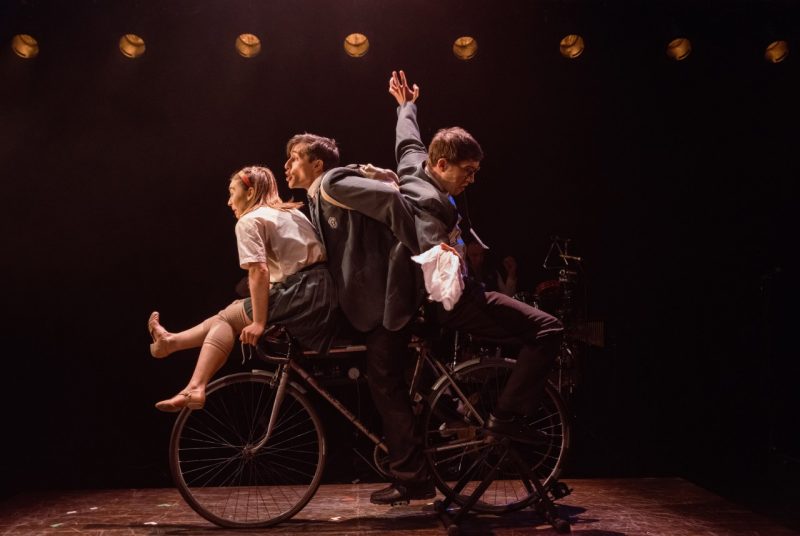 Three cast members ride a bicycle for a scene from "The Nature of Forgetting."