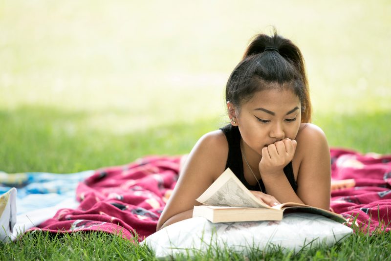 image of a woman reading a book 