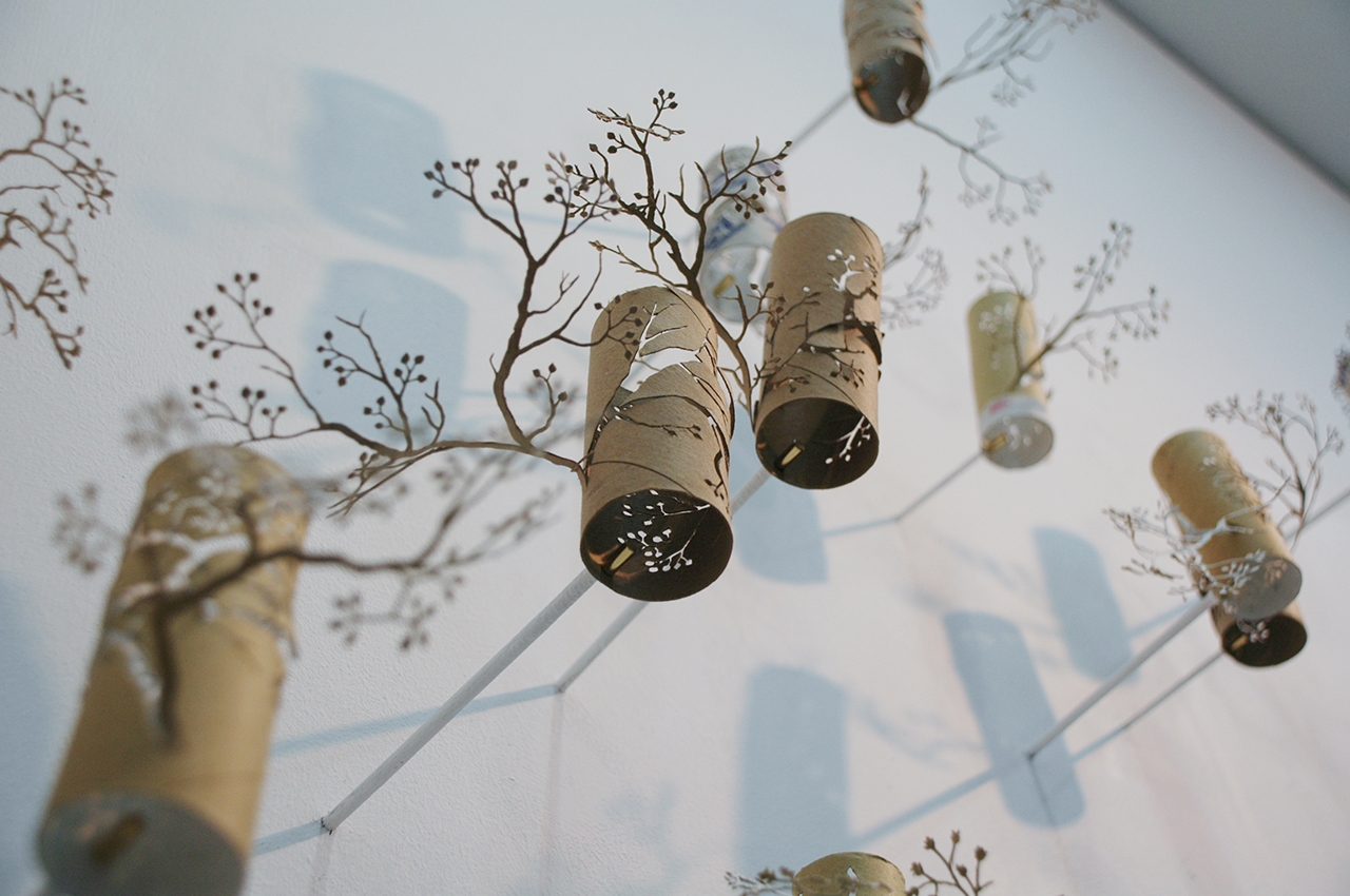 Yuken Teruya's work, “Corner Forest,” features paper rolls, painted steel, and magnets.