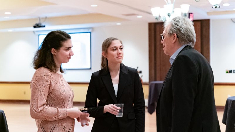 Dean Paul Knox converses with honors students at the Honors College Spring Convocation, where students were recognized with the Norrine Bailey Spencer Strong Start Award.