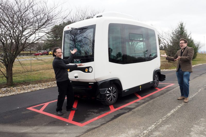 Saul Halfon (left) and Lee Vinsel playfully consider a low-speed autonomous shuttle undergoing testing at the Virginia Tech Transportation Institute.