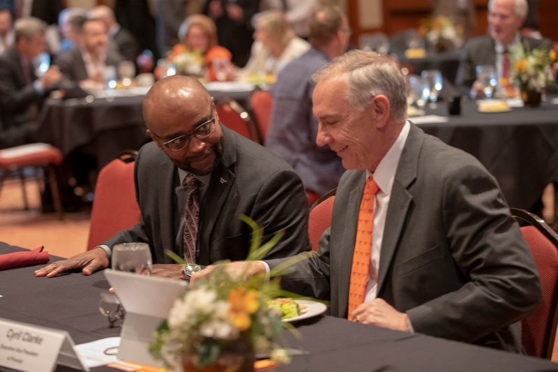 Dwayne Pinkney (left) and Cyril Clarke talk during Sunday's meeting of the Virginia Tech Board of Visitors