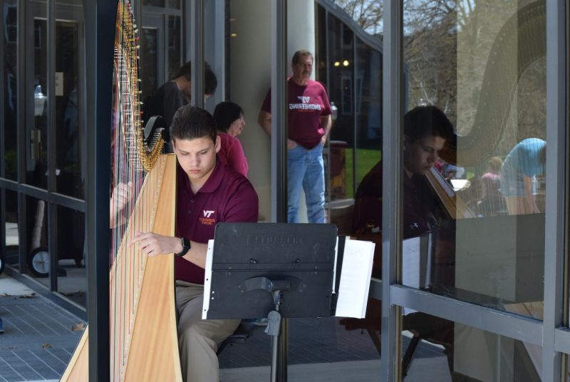 A student plays the hard on campus for Virginia Tech Music Day.
