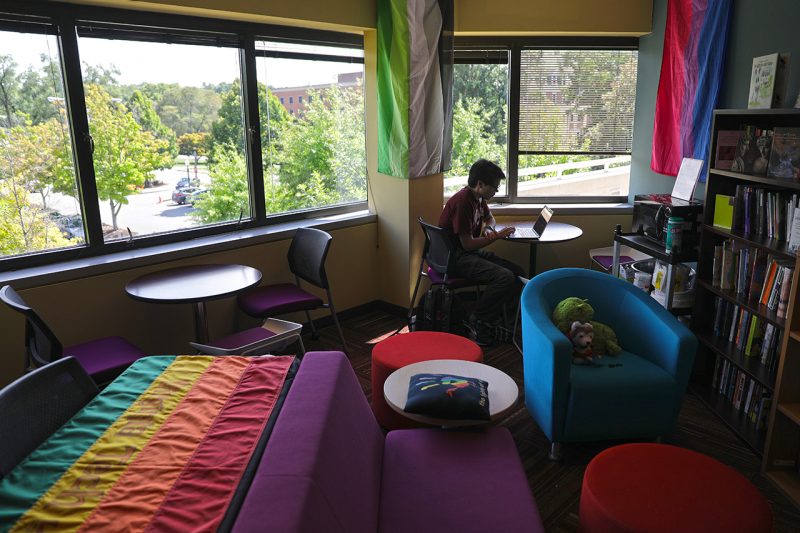 A student works in the LGBTQ+ resource center. 