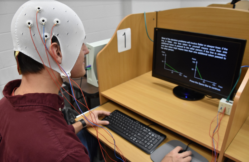 Researcher using transcranial electric current stimulation equipment