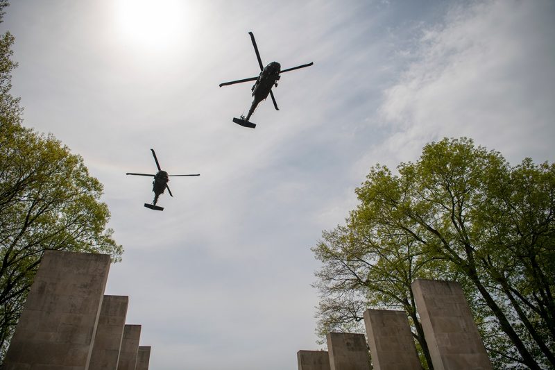 Helicopters fly over campus