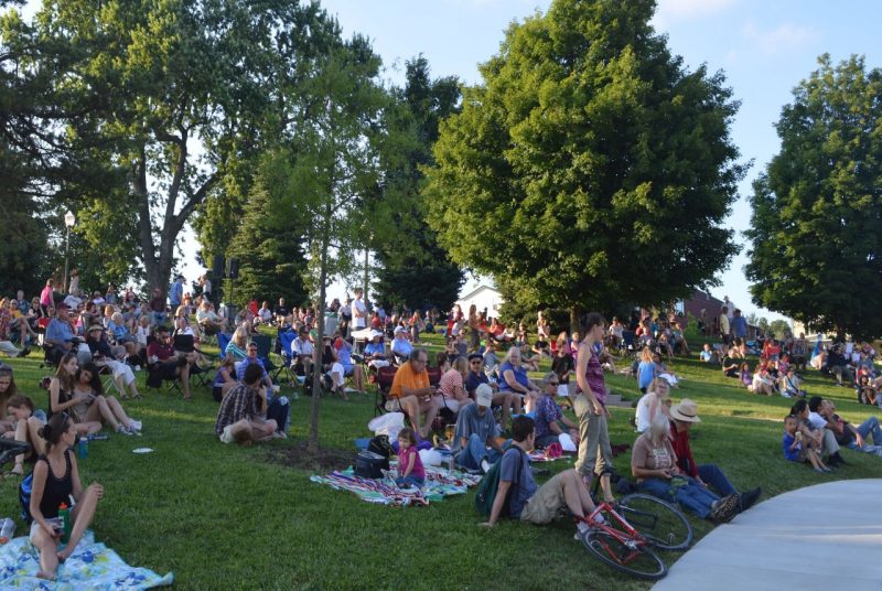 Concert goers gather on Henderson Lawn to enjoy a live music concert