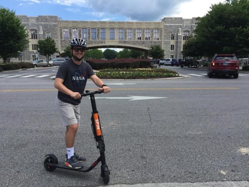 image of man on scooter 