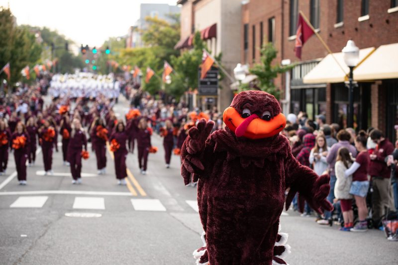 The HokieBird marches down Main Street during the Homecoming Parade. 