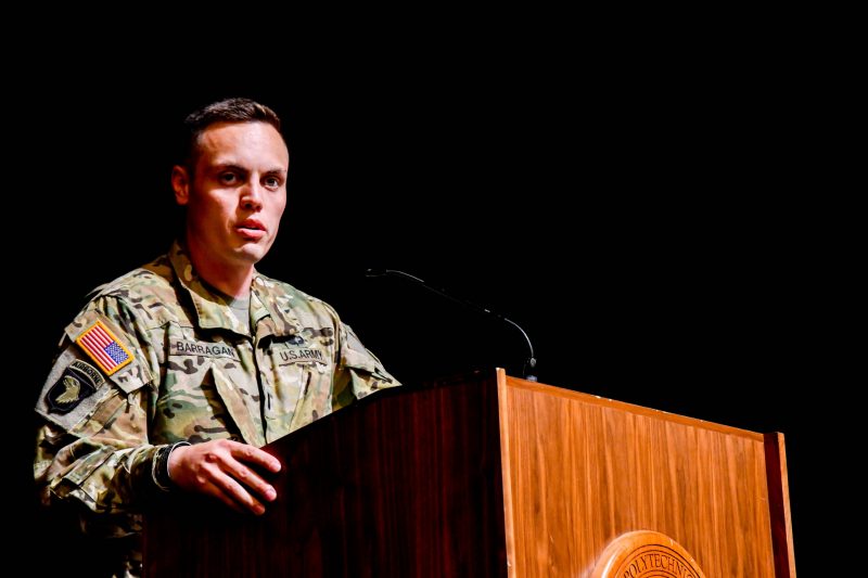 U.S. Army Capt. Aaron Barragan speaks at a podium