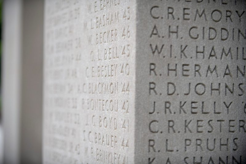 A closeup image of more than two dozen names engraved on one of the Pylons.