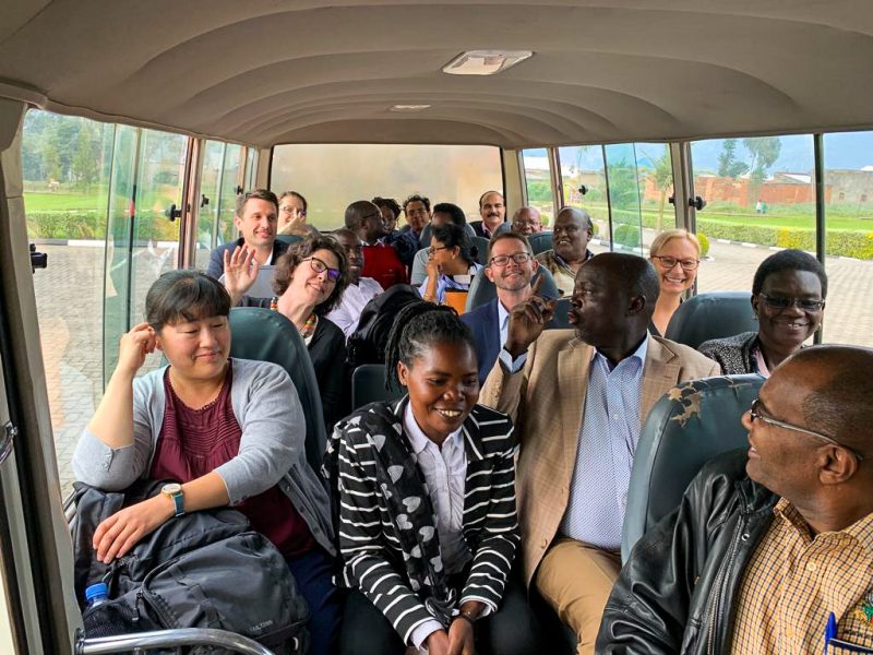 Fellows and Egerton faculty converse during a bus ride to the next site