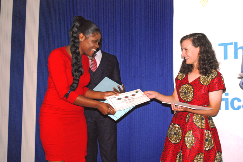 Brianna Friedman, right, presents Tadala Makuluni (left) with certificate.