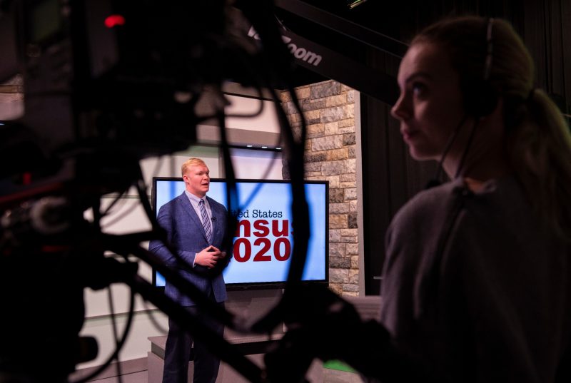 Andrew Webb, a senior majoring in multimedia journalism, does a news segment in the Department of Communication’s broadcast studio in the Moss Arts Center. 
