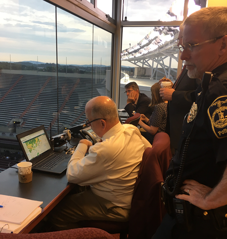 John Beach monitoring weather during the 2019 commencement at lane stadium