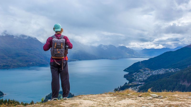 Students at the top of Queenstown Hill in New Zealand overlooking the city of Queenstown and Lake Wakatipu. 