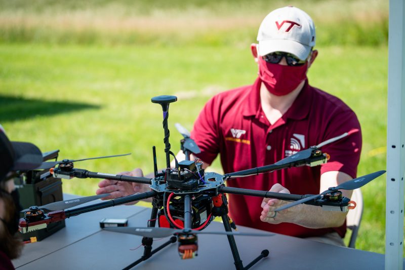 pilot checks balance of a drone 