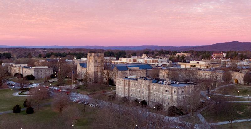 An aerial photo shows the Drillfield at sunset