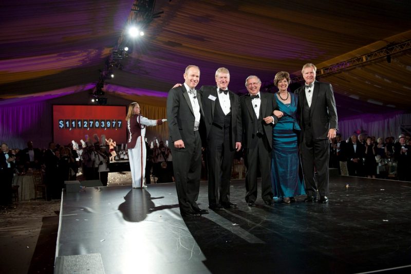 Betsy Flanagan alongside former Virginia Tech President Charles W. Steger (third from left) and campaign leaders Dave Calhoun and Gene Fife (at left) and John Lawson (at right) at the November 2011 closing of The Campaign for Virginia Tech: Invent the Future.