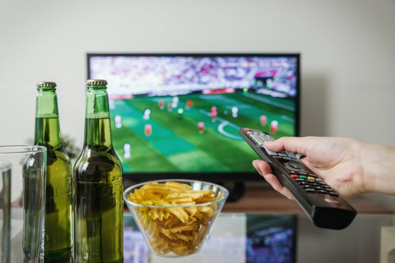 Image of person watching sports on TV 