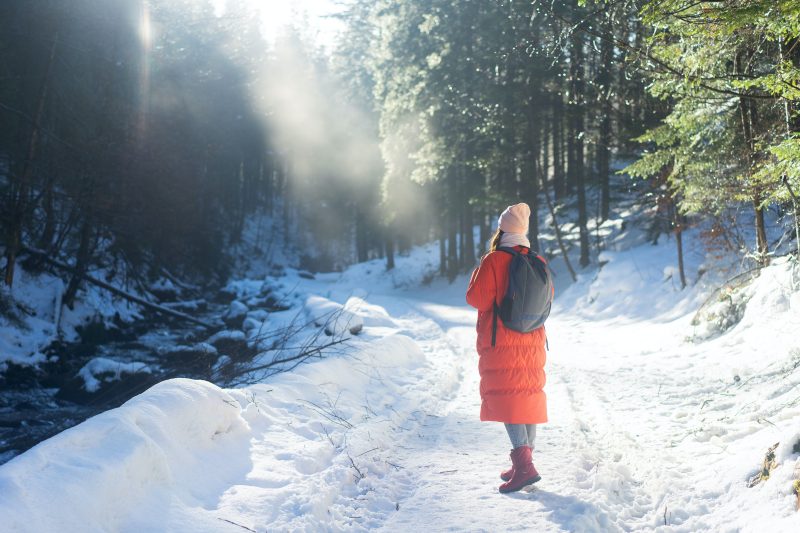 Image of woman hiking in the snow 