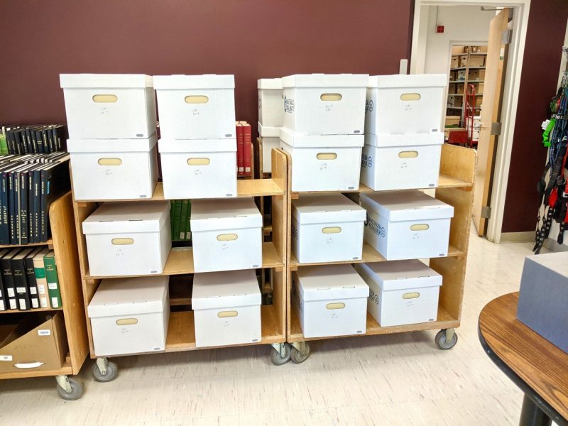 The collection is pictured in boxes in Special Collections and University Archives. 