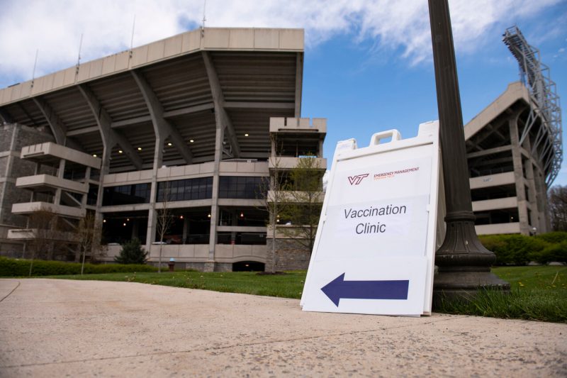 A sign that reads "Vaccine clinic" is seen outside Lane Stadium