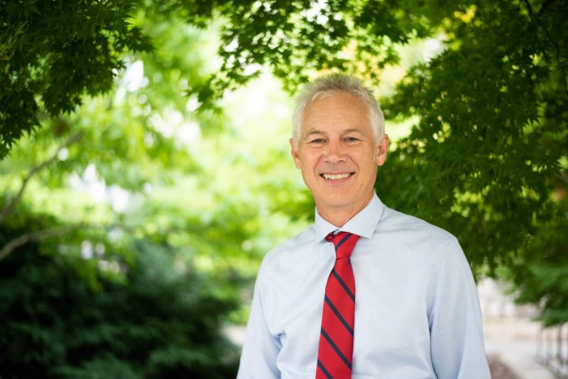 Photo of Richard Blythe, dean of the College of Architecture and Urban Studies, taken beneath leafy trees