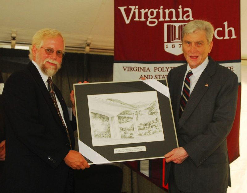 Former U.S. Senator John W. Warner (right) alongside Virginia Tech Transportation Institute Director Tom Dingus (left) at an event at the institute in 2006.
