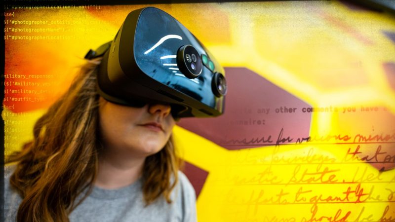 Student with VR google with text overlays.