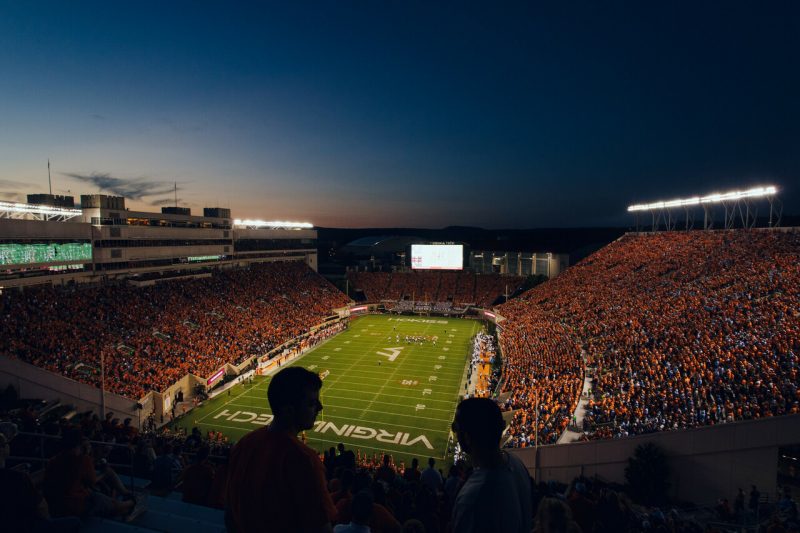 A panoramic shot shows Lane Stadium, filled with fans, at nighttime 