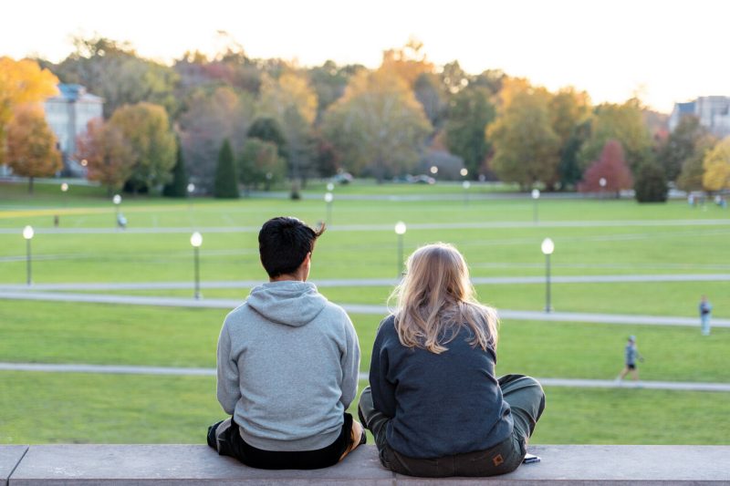 Two students looking over the Drillfield.