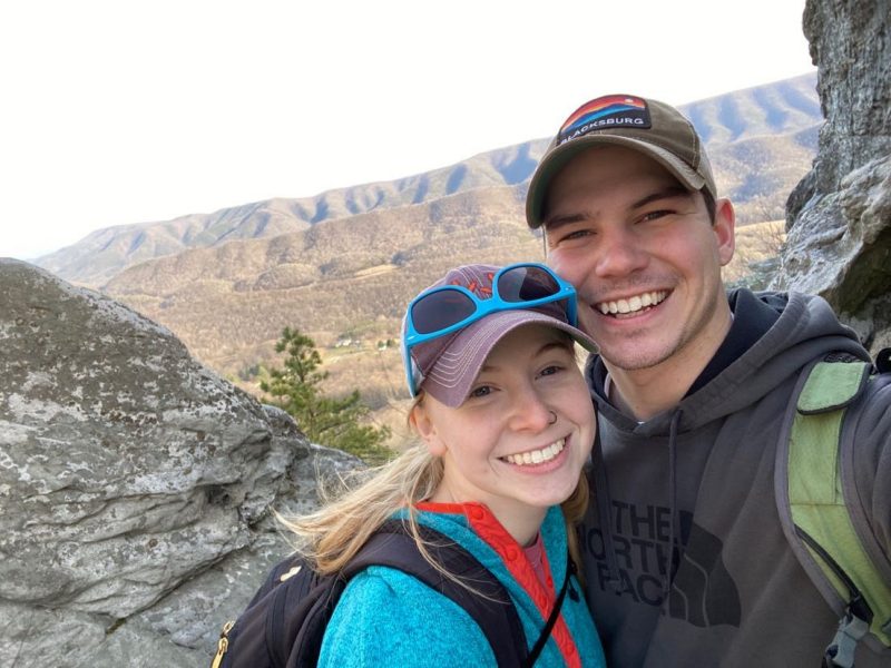 couple take photo while hiking