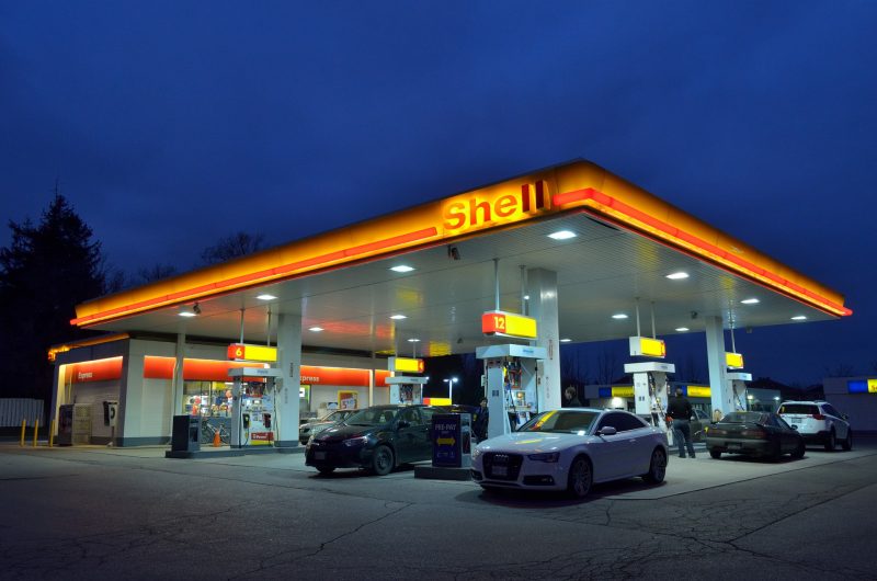 Gas station with cars at pumps