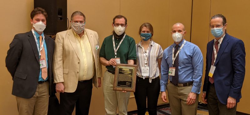 The award was received by Clay's students, colleagues, and friends (pictured left to right) : Luke E. Riexinger,  Warren Hardy, Max Bareiss, Morgan E. Dean, Douglas Gabauer and presented by John P. Donahue, chair of the Roadside Safety Design Committee (far right). 