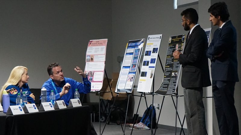 The Hokienauts receive feedback on their space suit designs from NASA experts Kate Rubins, astronaut, and Chris Hansen, extravehicular project manager while at Johnson Space Center for the NASA SUITS competition. Photo courtesy of Wallace Lages.