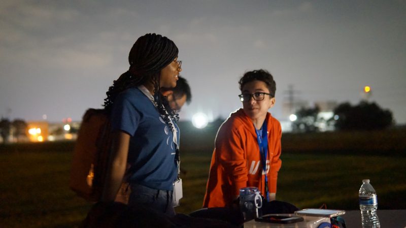 Jasmine Walker, left, a senior majoring in creative technologies and minoring in computer science, talks with fellow teammate Sabrina Lesser, a 2022 graduate majoring in electrical and computer engineering graduate , during the testing night at Johnson Space Center's Rock Yard. Photo courtesy of Wallace Lages.