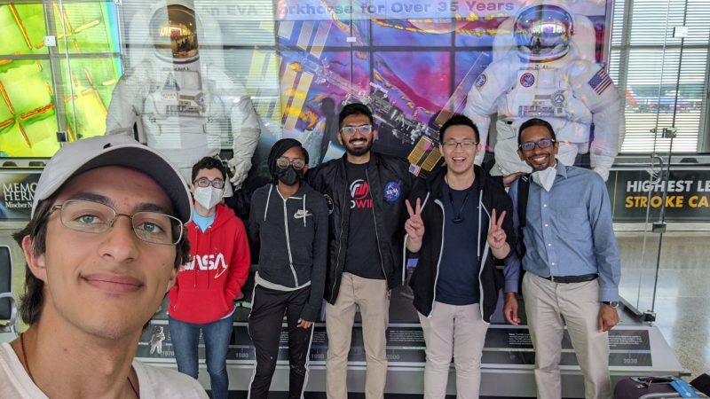 The Hokienauts, left forefront, Burak Topo, lead software engineer and minister of photography; Sabrina Lesser, hardware engineer; Mithil Adsul, lead hardware engineer and team lead; Kien Tran, software engineer; and Wallace Lages, faculty advisor in the School of Visual Arts.