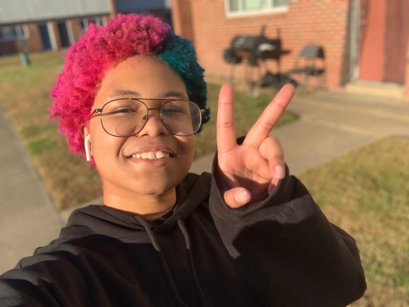 Levi Shoate poses with pink and blue hair