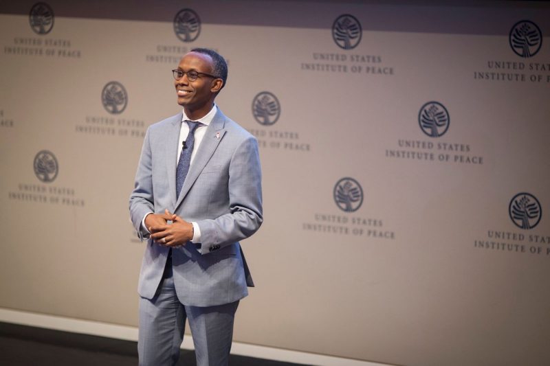 Thomas Debass ’97, ’00 received his B.A. in Economics and M.S. in Agricultural and Applied Economics. He is seen here giving remarks during the Unreasonable Global Summit in 2017 at the United States Institute for Peace in Washington, D.C. Photo courtesy of Chet Strange.