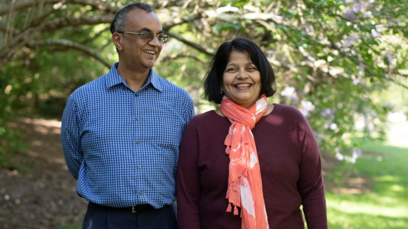 Virginia Tech researchers and married couple T.M. Murali and Padma Rajagopalan stand at the drillfield.